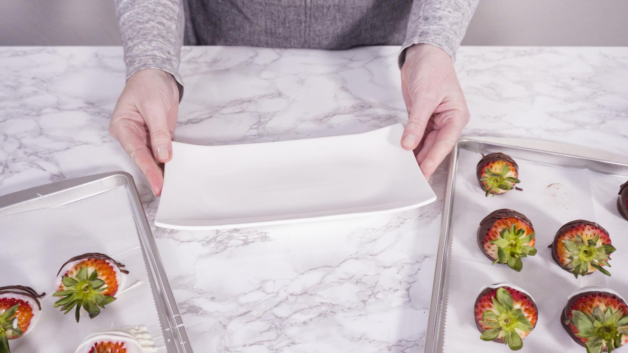 chef arranging meal box with colorful ingredients