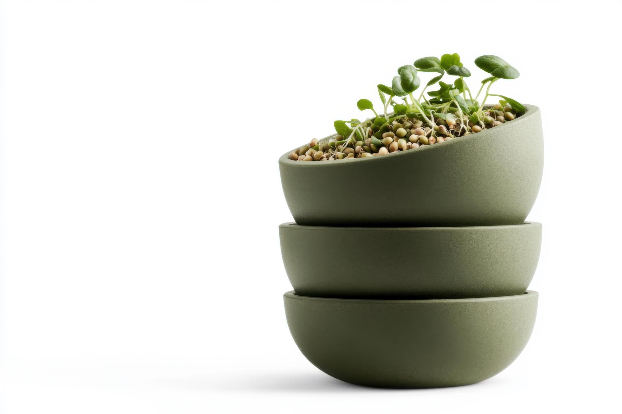 stack of healthy bowls with grains and greens
